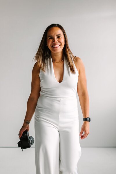 Mika Indianapolis wedding and elopement photographer posing with smiles and camera