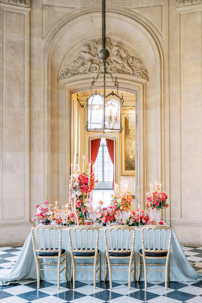 Bride and Groom Sit Together at Chateau de Courtomercaptured by Luxury Destination Wedding Photographer Katie Trauffer