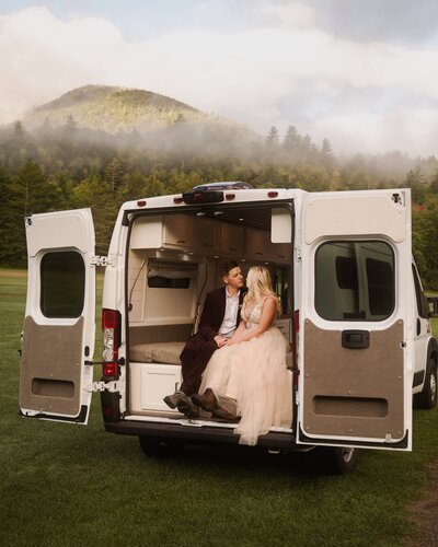 Finishing getting ready for their Adirondack elopement in a camper van.