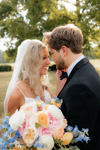 bride and groom together during their couple portraits near the puget sound on wedding day photographed by wedding photographer sarah mismash in seattle Washington