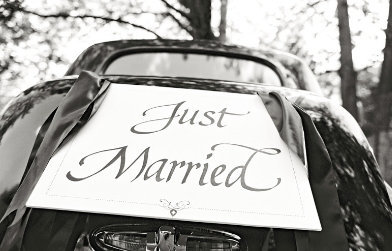 Grass Valley Wedding Fair bride and grooms get away vintage car with Just Married sign at venue Empire Mine State Park Wedding, Joy of Life Events wedding planner