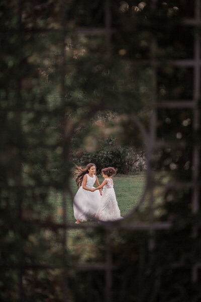 sisters dancing  for photos during family photography session in north jersey.