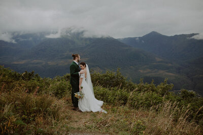 Couple snuggles together during Alaska elopement