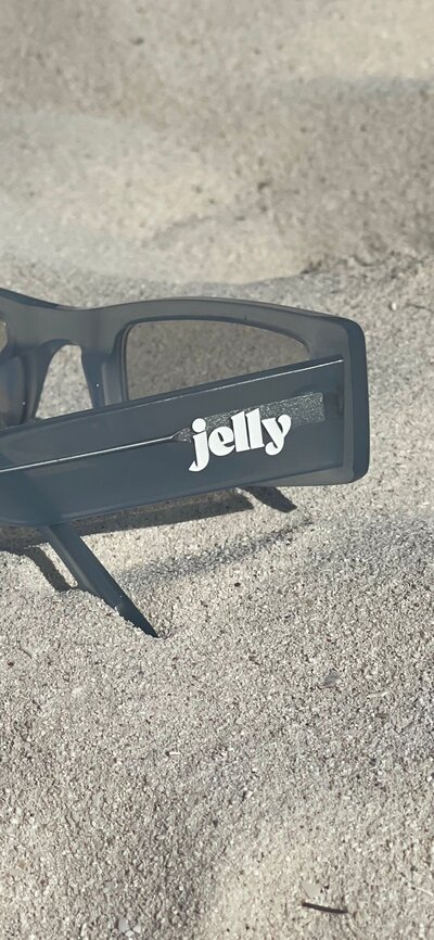 Jelly sunglasses in sand