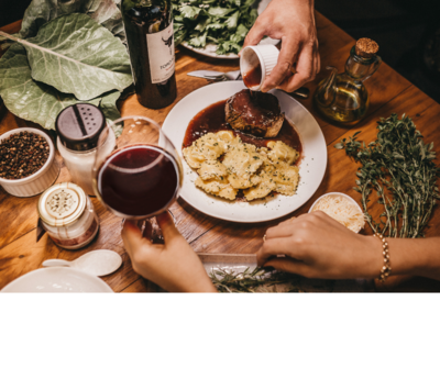 Table setting with wine and pasta at a Yarmouth, NS restaurant