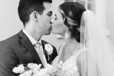 close up of groom kissing bride