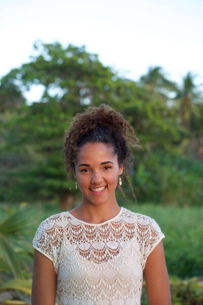 Yoga teacher training graduate Sierra sharing her transformative experience in Costa Rica