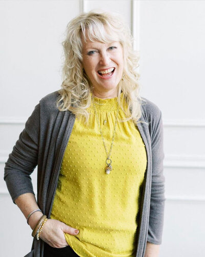 Springfield florist DelJean smiles representing her loving spirit and passion for floral design.
