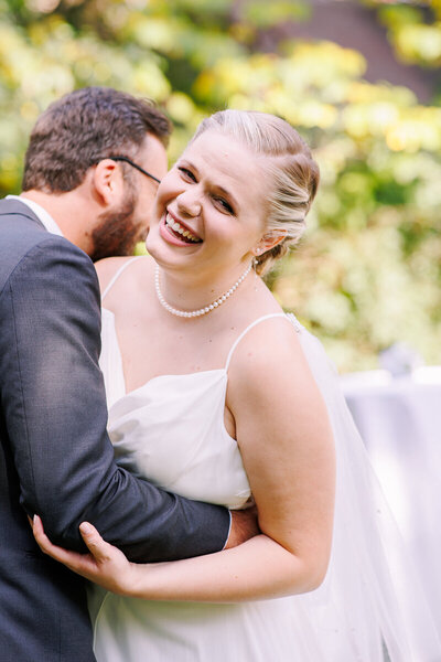 Emily and Brett embrace outdoors at their Leesburg VA wedding