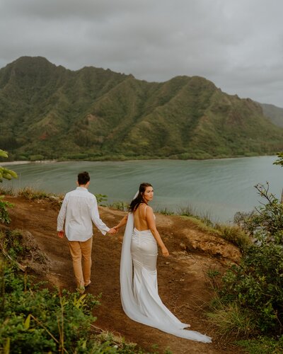 bride and groom holding hands