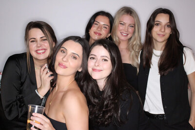 Group of friends posing for photo booth in Vancouver