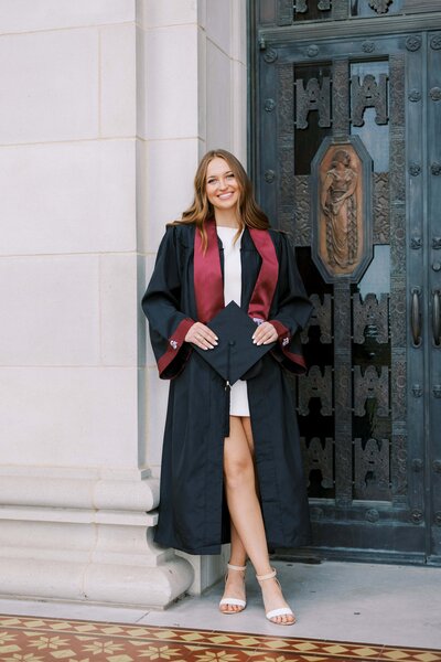 senior dresses with cap, gown and stole with the colors of A&M