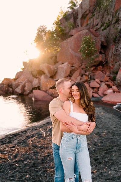 engaged couple hugging