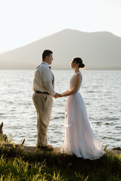 Couple embracing near a cliff edge on the Oregon Coast.