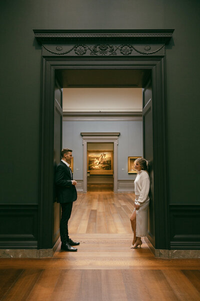 bride and groom at art museum engagement session