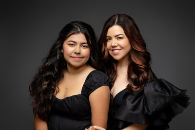 Mother and daughter smile for portraits