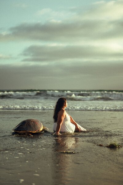 Women sitting down on sand,