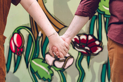 A couple holds hands during their engagement session in downtown Chicago
