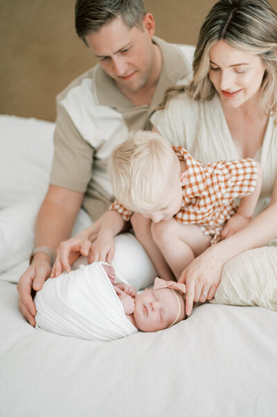 Close up of mom and dad cradling new baby bump, captured by Edmonton maternity photographer, Kahla Kristen