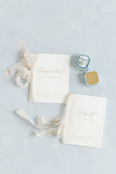 wedding vow books and rings by tampa wedding photographer