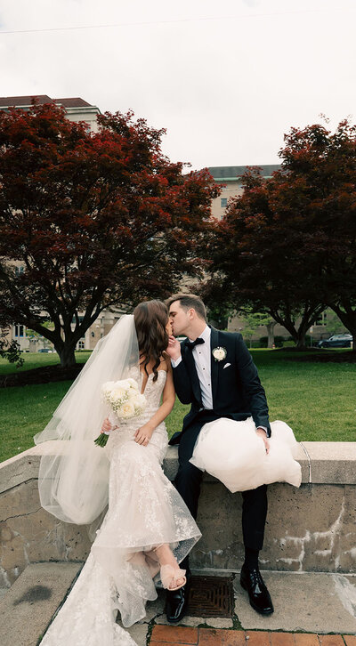 Bride and Groom kiss in Oakland after their wedding at Soldiers and Sailors