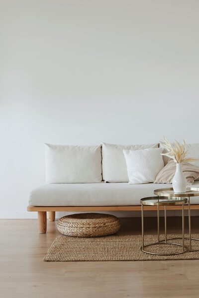 White couch on rattan rug