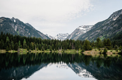The mountains at Snoqualmie Pass make a perfect reflection on Gold Creek Pond
