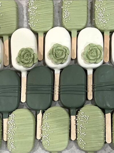 Elegant sage green cakesicles from Dip’d Desserts in Portland, Oregon, crafted with a modern, luxury aesthetic perfect for weddings, showers, and upscale celebrations.