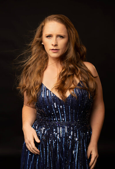 wonderful picture or woman wearing a sequin blue dress taken by Austin fashion photographer