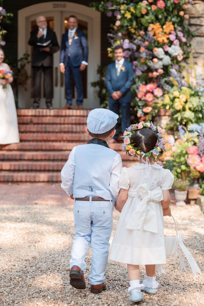 Bride in hallway at Duke Mansion taking wedding photos