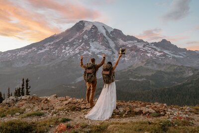 bride and groom in front of mountain