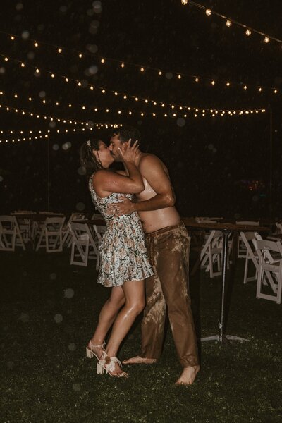 Couple shares romantic kiss in the rain