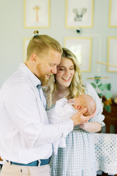 Shelby and her husband holding her newborn baby