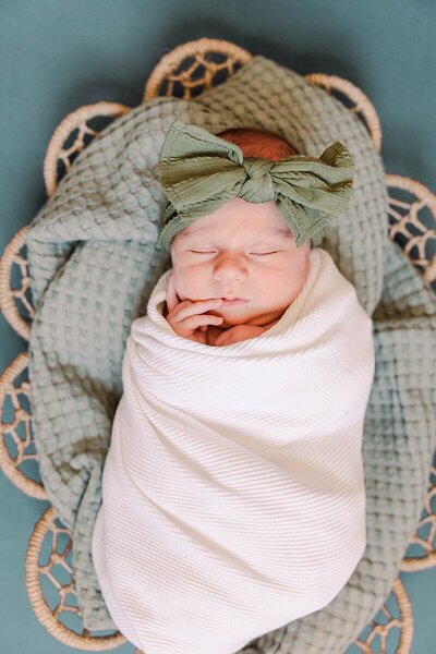 Cozy lifestyle newborn session in Staunton, VA, featuring soft neutrals and warm family connections.