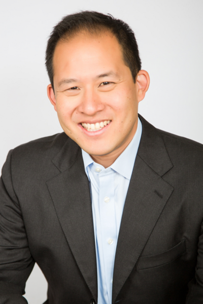Headshot of Joseph Lee, a Film & Ink Entertainment Lawyer with short brown hair, brown eyes, wearing a black suit jacket and light blue shirt.