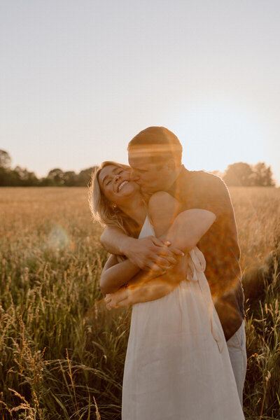 man hugging woman from behind