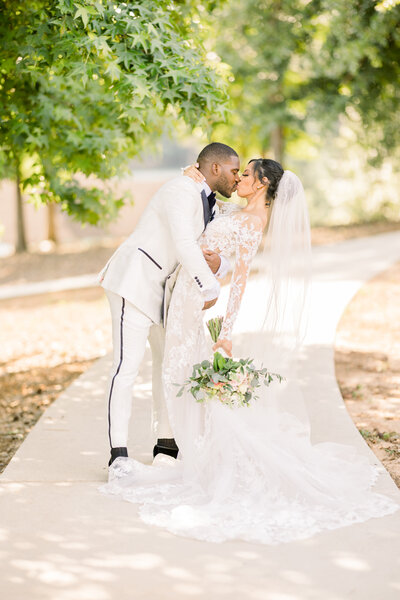 legacy lookout wedding, bride and groom dip & kiss, douglasville ga wedding photographers