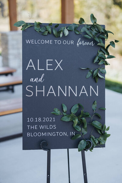 welcome sign with green floral