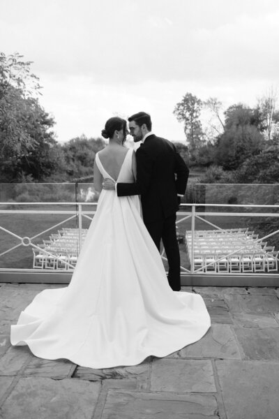 Black and white image of bride and groom lovingly looking at each other at Harding Waterfront Estate in Toronto 