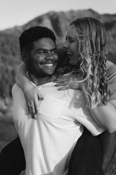 Couple up at the gorge giving a piggy back ride.