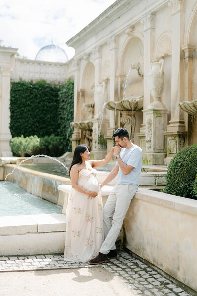 Pregnant mother poses at Longwood gardens during her maternity session with AnneMarie Hamant