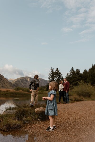 family of four spending time together at a lake in Colorado