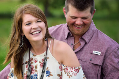 Oklahoma couple laughing during engagement pictures
