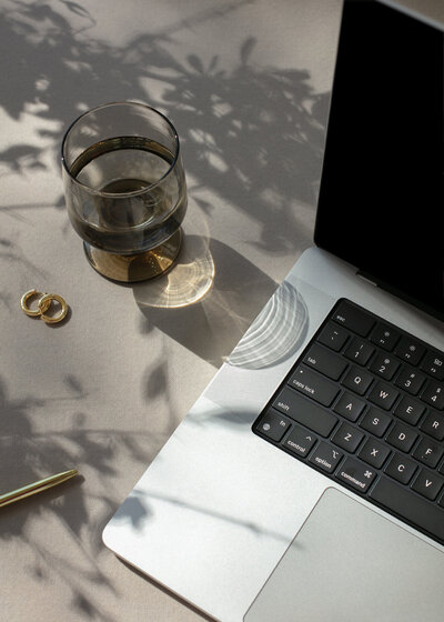 Water and Laptop in afternoon sun