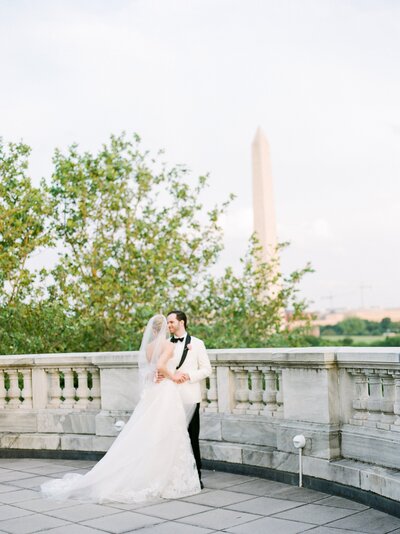 Bride and groom smiling at each other