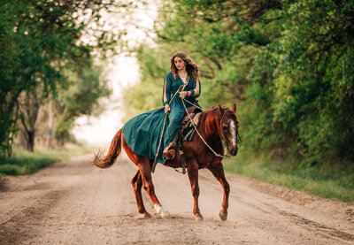 blonde girl posing with sports horse