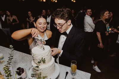 couple cutting wedding cake at denver colorado wedding