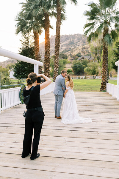 stephanie of megan helm photography photographing bride and groom sunset wedding portraits