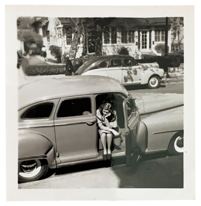 Black and white photo of Amy's grandmother sitting in a car