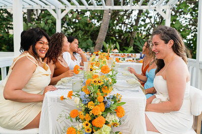 smiling girl at beach brunch table with friends